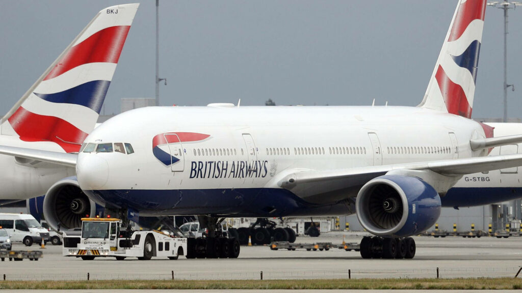 British Airways Boeing 777 G STBG on runway with blue white red livery airport planes background Wallpaper