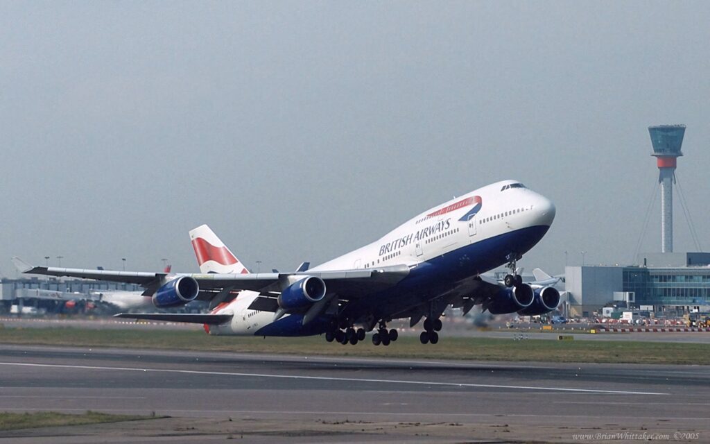 British Airways Boeing 747-400 jumbo jet taking off runway airport control tower clear sky wallpaper