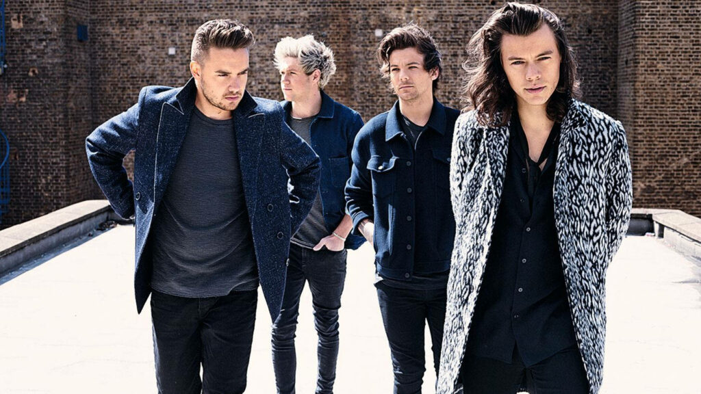 Harmonious Melodies: One Direction Unleashes Their Musical Spirit on a Rooftop Wallpaper