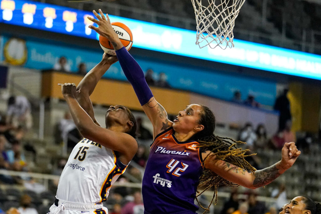 Brittney Griner blocks shot in WNBA game wearing Phoenix Mercury purple orange uniform action wallpaper
