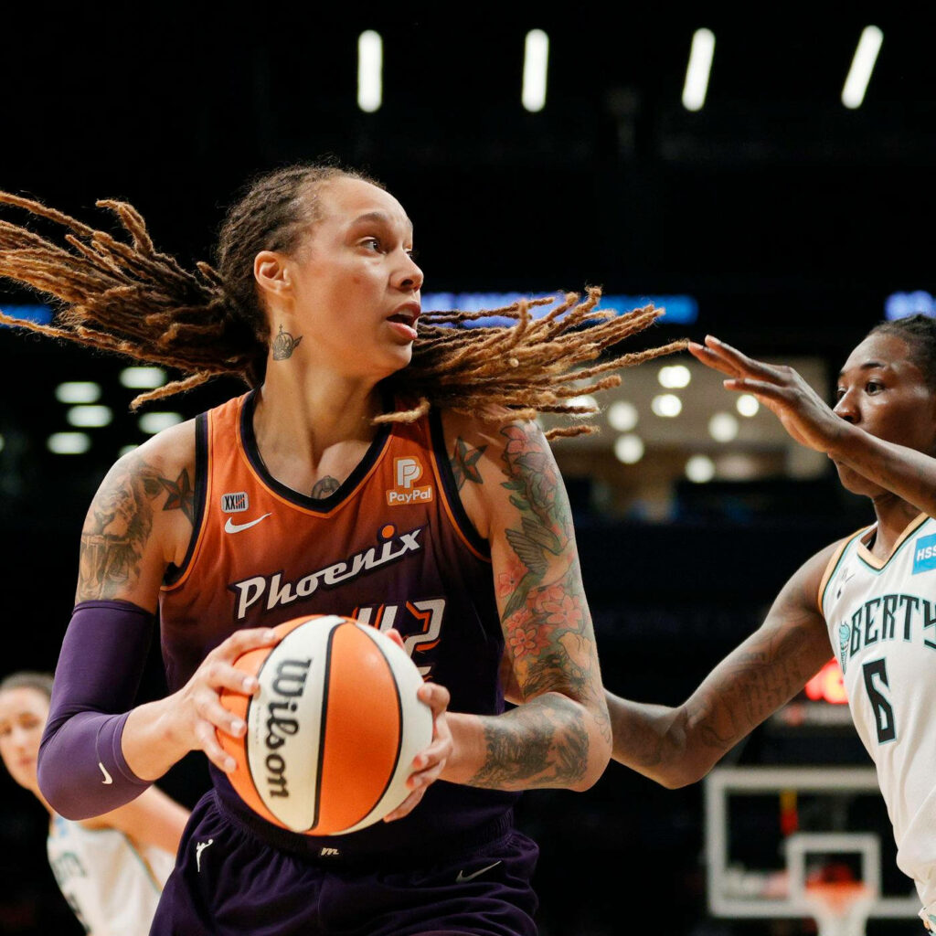 Brittney Griner Phoenix Mercury defending basketball intense WNBA game action wallpaper background