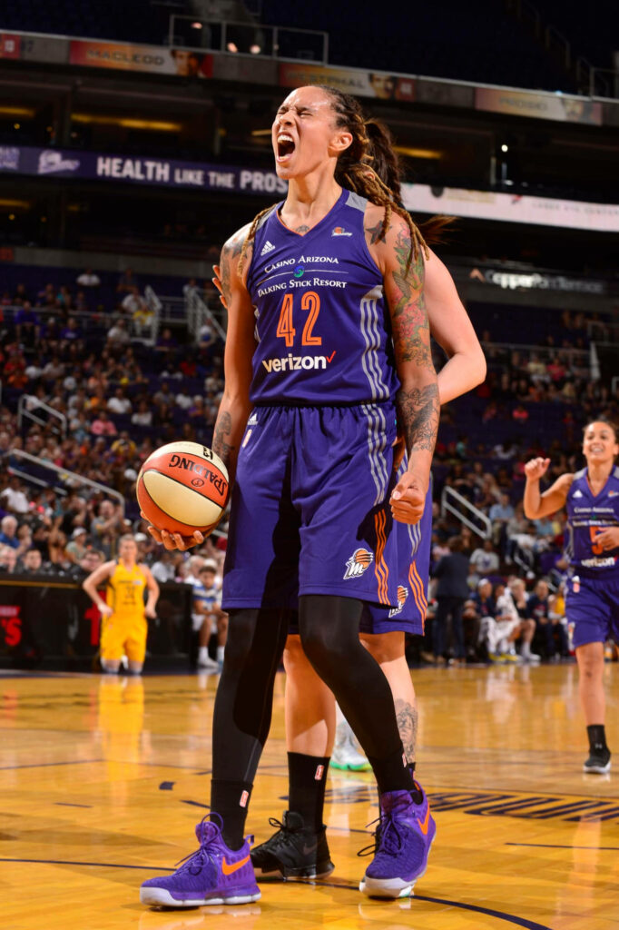 Brittney Griner screaming with clenched fists in Phoenix Mercury jersey vibrant tattoos wallpaper