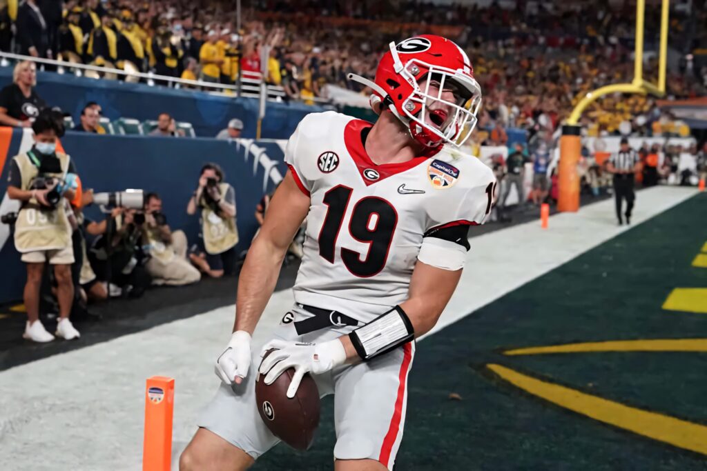 Brock Bowers Georgia Bulldogs touchdown celebration vibrant football wallpaper action moment