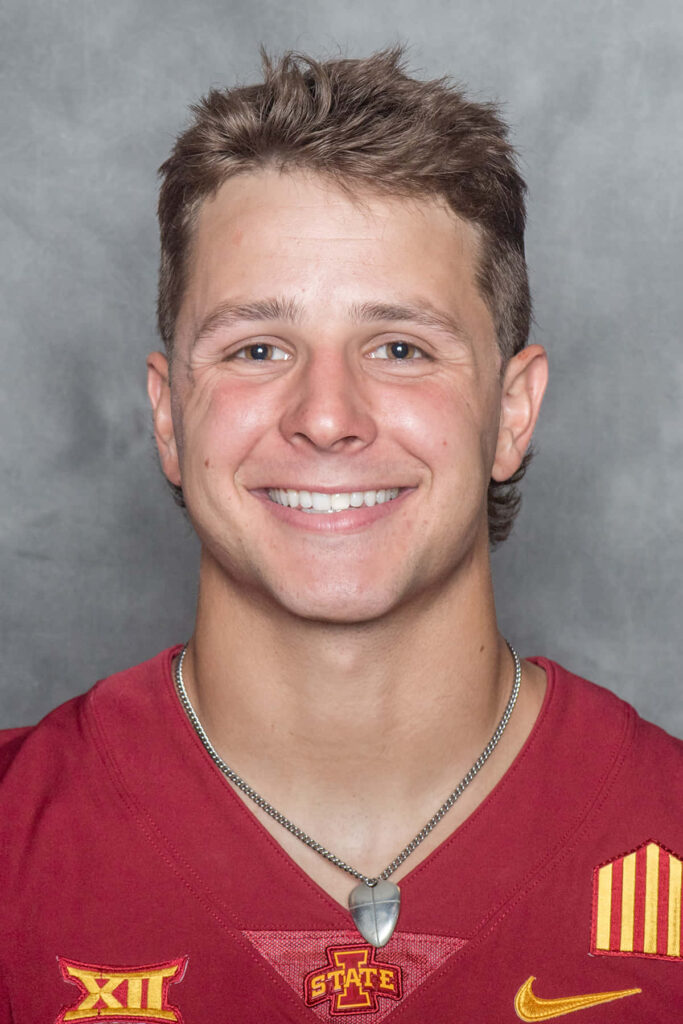 Brock Purdy Iowa State Cyclones close-up portrait in red and gold football jersey wallpaper
