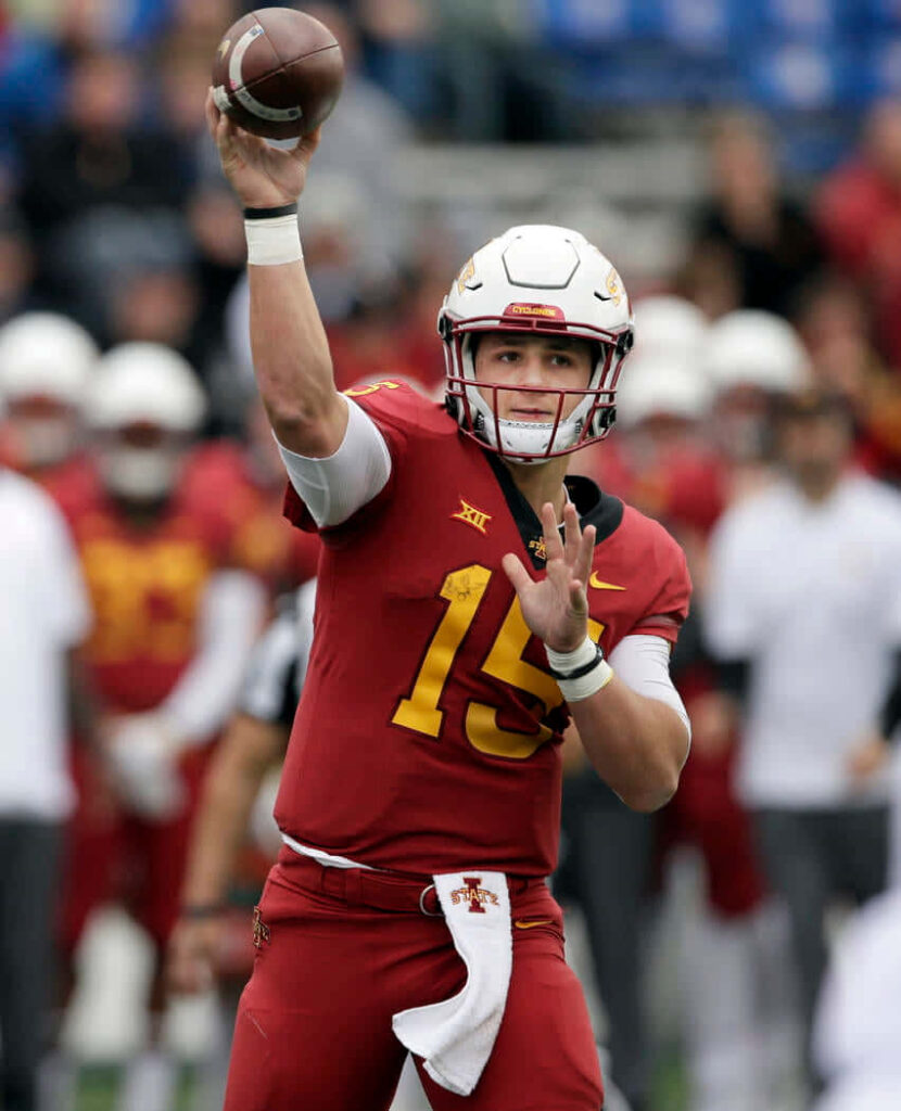 Brock Purdy Iowa State quarterback throwing football mid-pass in red and gold uniform action Wallpaper