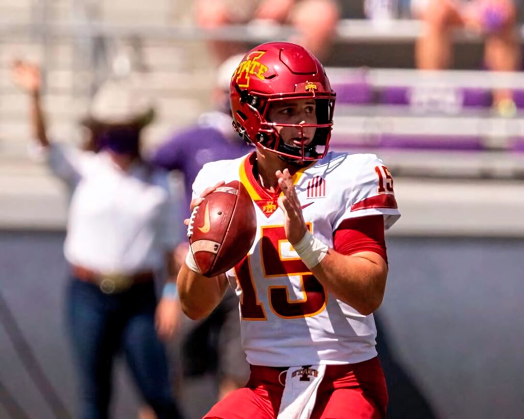 Brock Purdy Iowa State quarterback in red gold uniform in action HD football wallpaper background