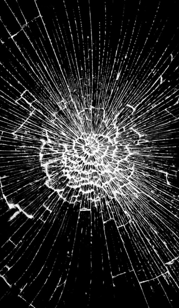 Broken glass wallpaper with intricate web-like cracks on bold black background edgy design