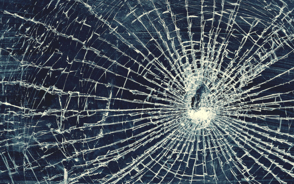 Broken glass wallpaper with detailed shattered glass pattern on dark dramatic background