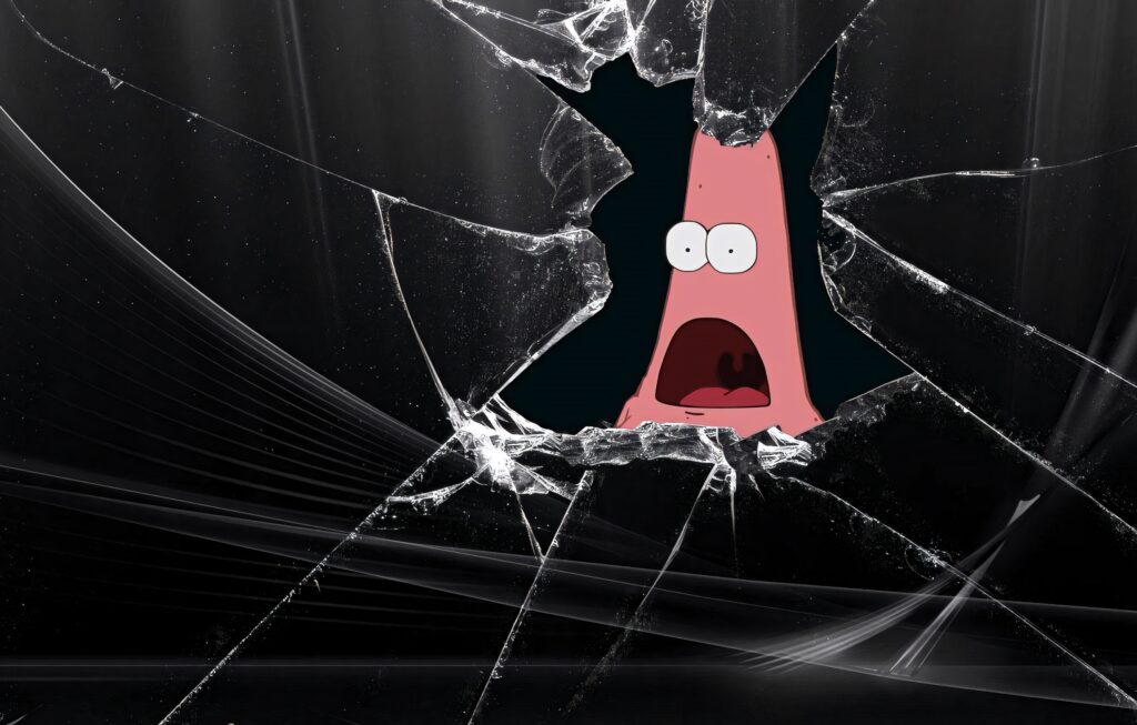 Broken screen wallpaper with shattered glass and upset Patrick Star from SpongeBob SquarePants peek