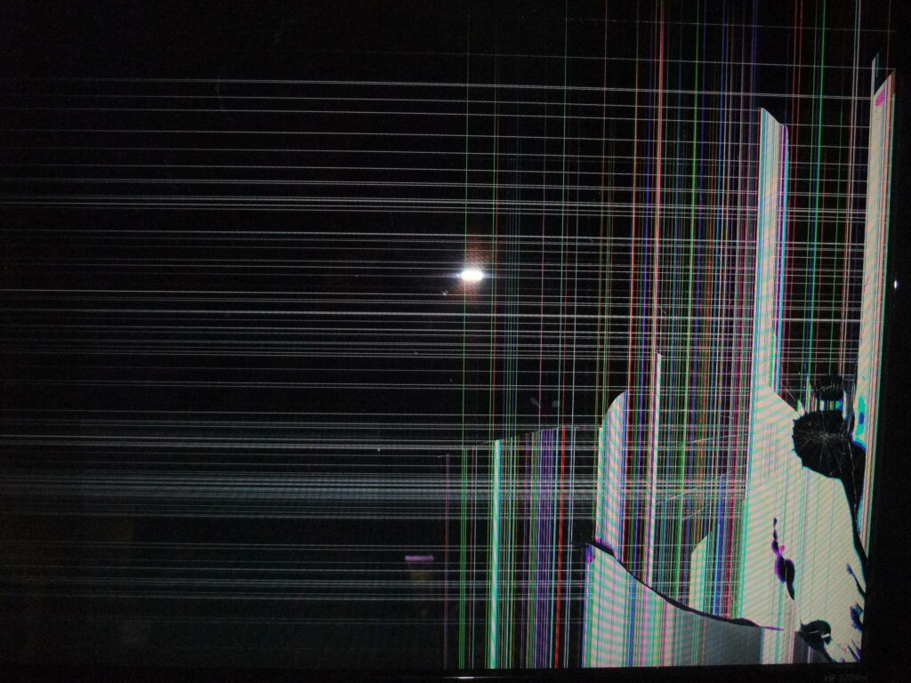 Shattered Spectrum: A 4K Wallpaper of a Broken TV Screen with Vibrant Colorful Lines