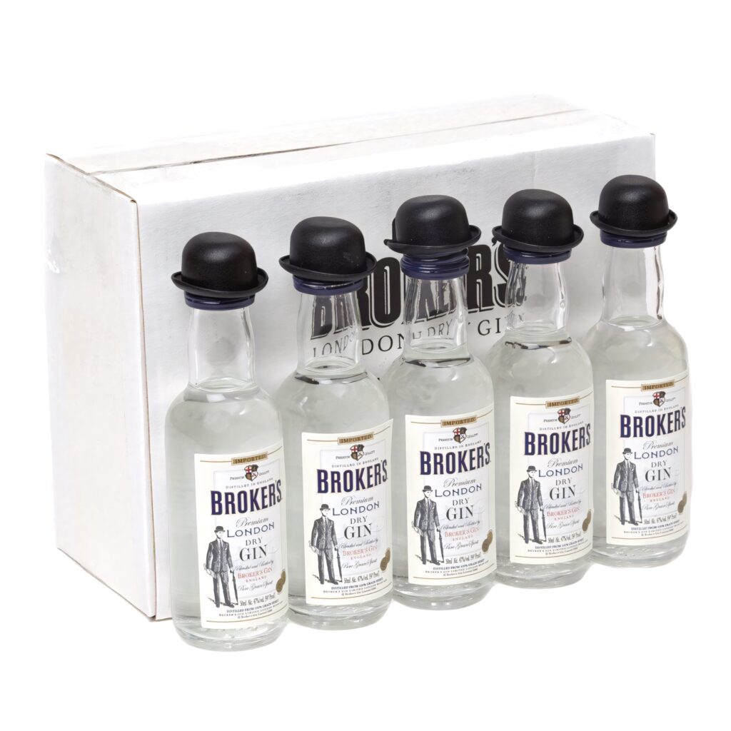 Broker's Gin miniature bottles with bowler hat caps displayed with branded box wallpaper background