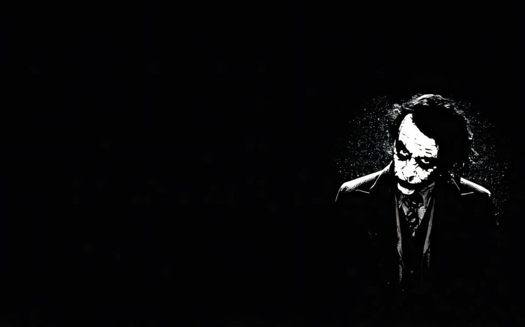 Melancholy Dark Wallpaper: Lone Figure with Painted Face on Black