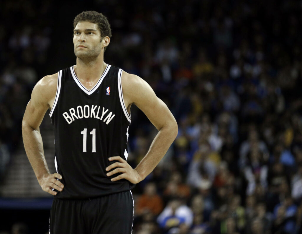 Brook Lopez Brooklyn Nets jersey 11 intense focus on court blurred crowd background wallpaper