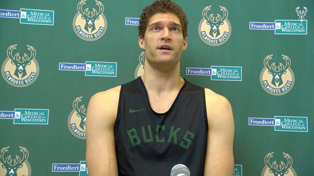 Brook Lopez Milwaukee Bucks press conference green backdrop sleeveless black jersey wallpaper