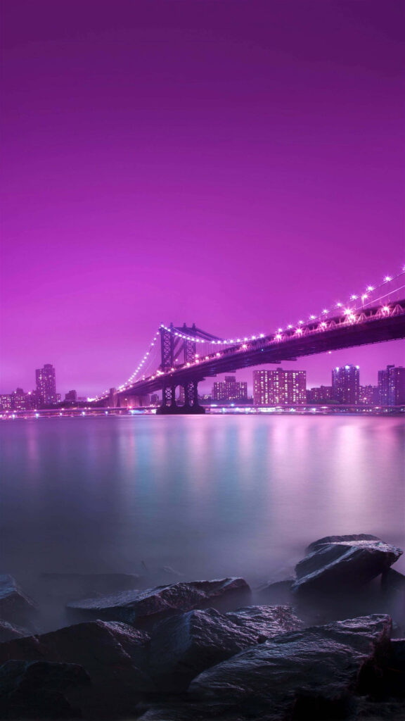 Night view Brooklyn Bridge Galaxy Note 4 wallpaper with illuminated bridge and purple sky reflections