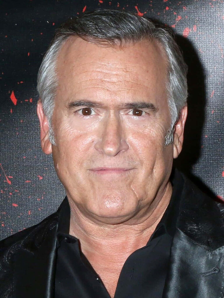 Bruce Campbell portrait in black suit on red and black dramatic background wallpaper