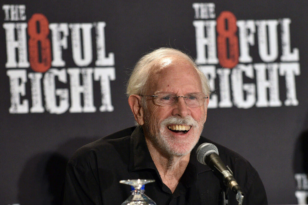 Bruce Dern smiling at The Hateful Eight press conference black backdrop cinematic wallpaper