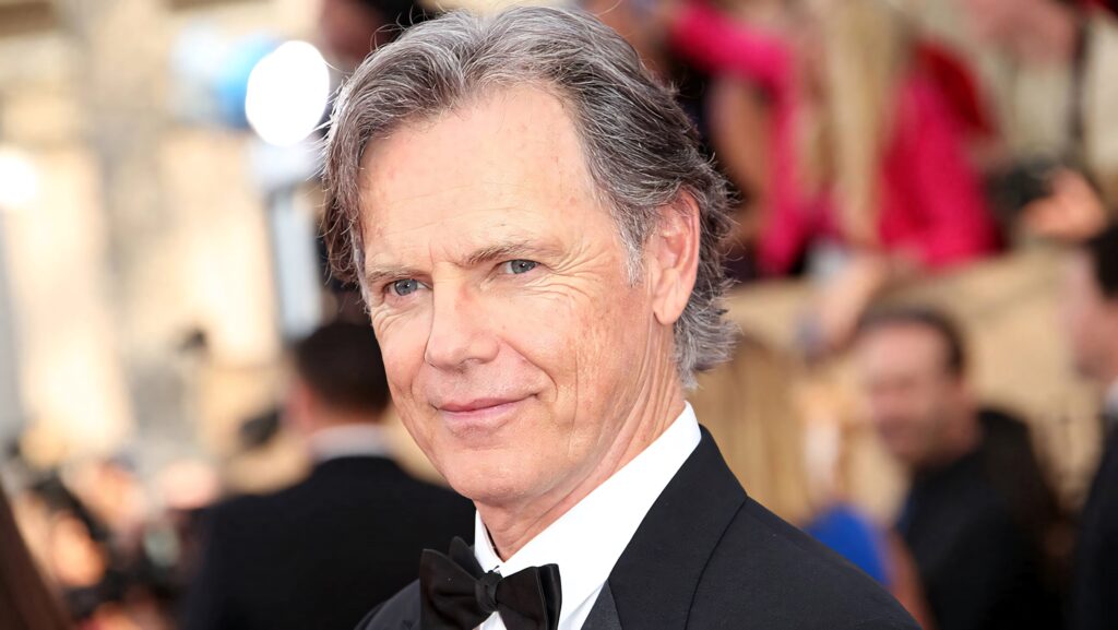Bruce Greenwood in black tuxedo at red carpet event elegant glamorous wallpaper background