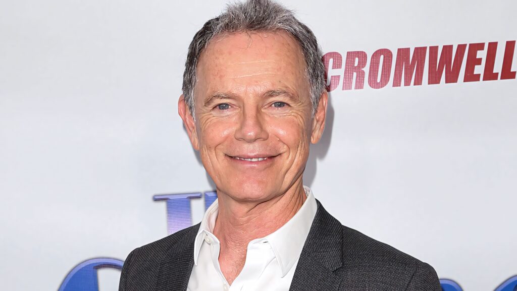 Bruce Greenwood confident in sharp gray suit white shirt professional portrait wallpaper background