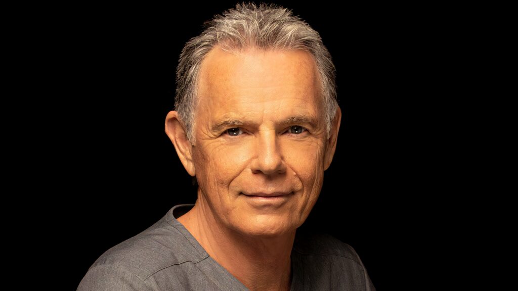 Bruce Greenwood portrait with salt and pepper hair on black background classy actor wallpaper