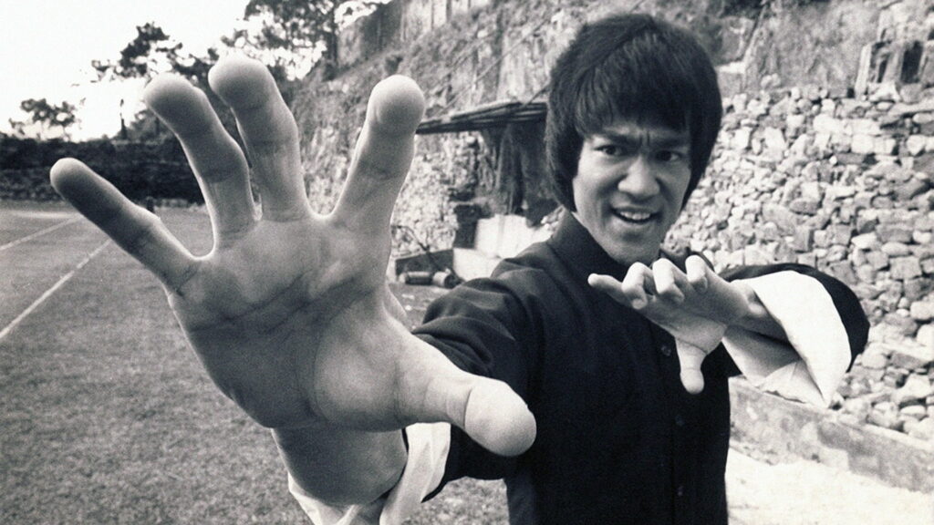 The Legendary Bruce Lee Unleashes His Kung Fu Skills in Mesmerizing HD Wallpaper