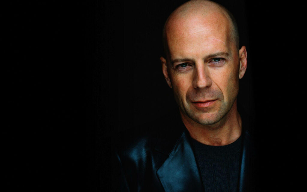 Bruce Willis intense gaze dark background celebrity photoshoot wallpaper background image
