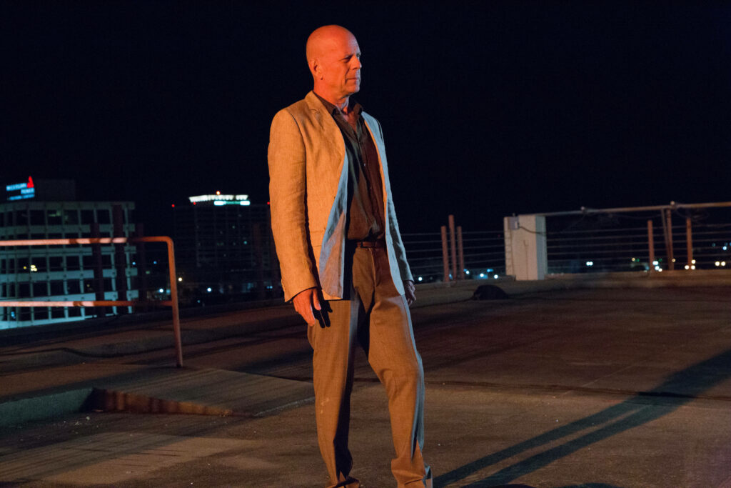 Bruce Willis on rooftop at night in Precious Cargo action movie urban skyline wallpaper background