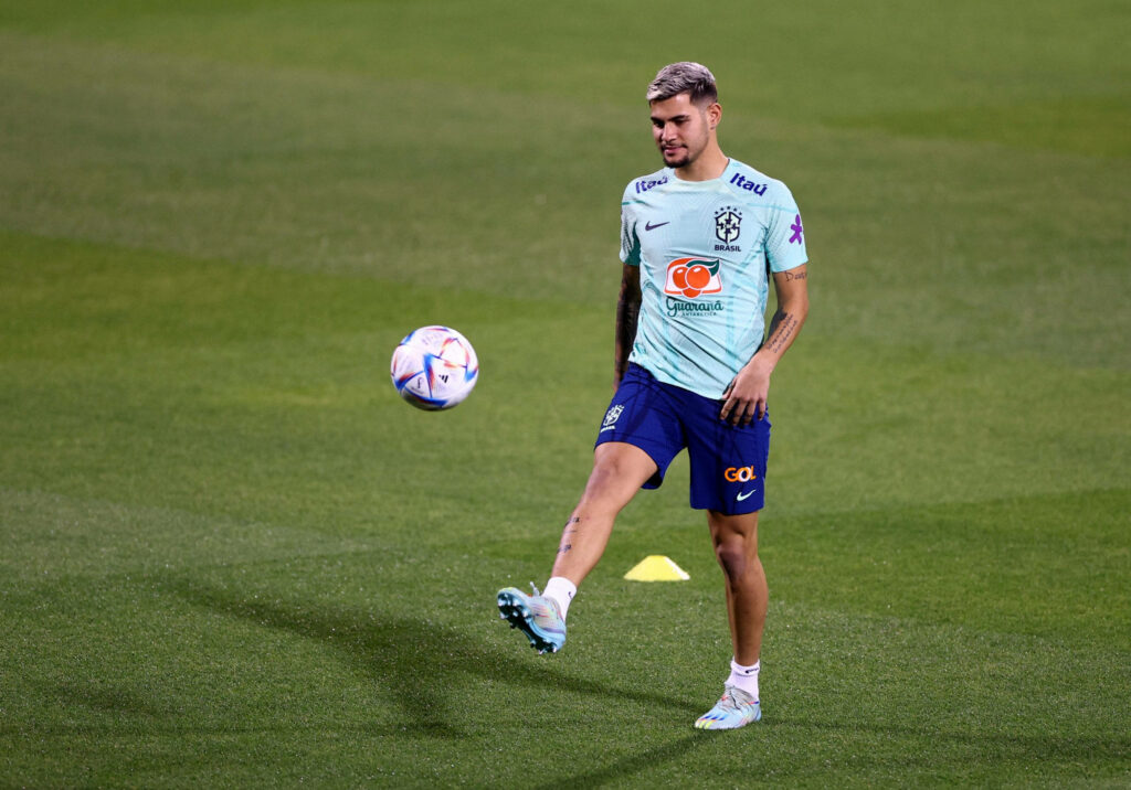 Bruno Guimarães Brazil footballer training kit balancing ball on grass dynamic soccer wallpaper