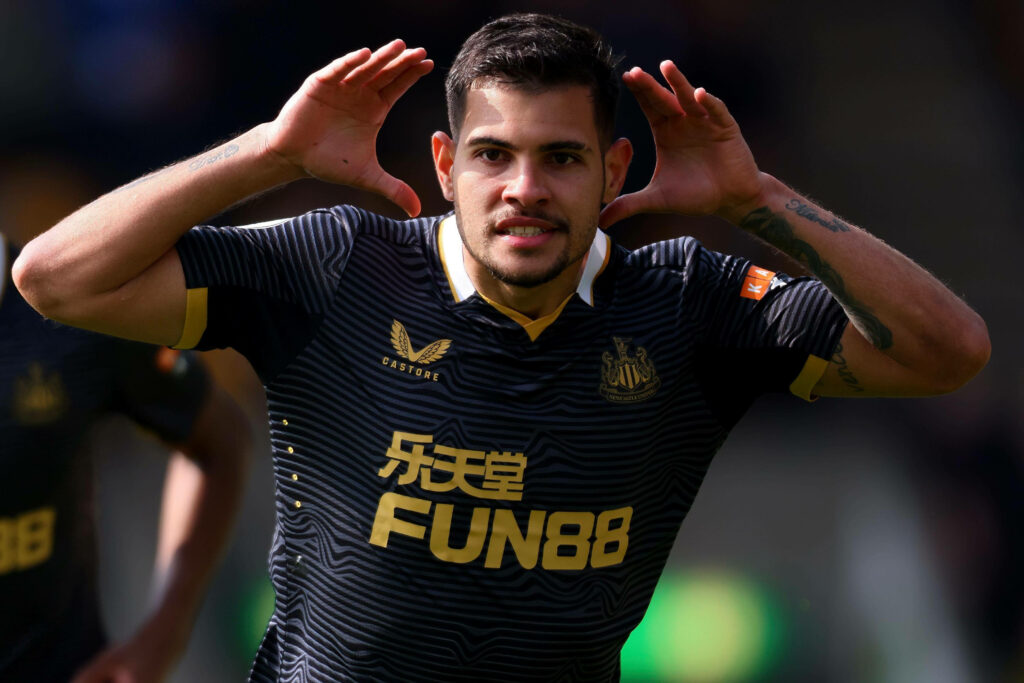 Bruno Guimarães celebrating football wallpaper Newcastle United midfielder black gold kit pose