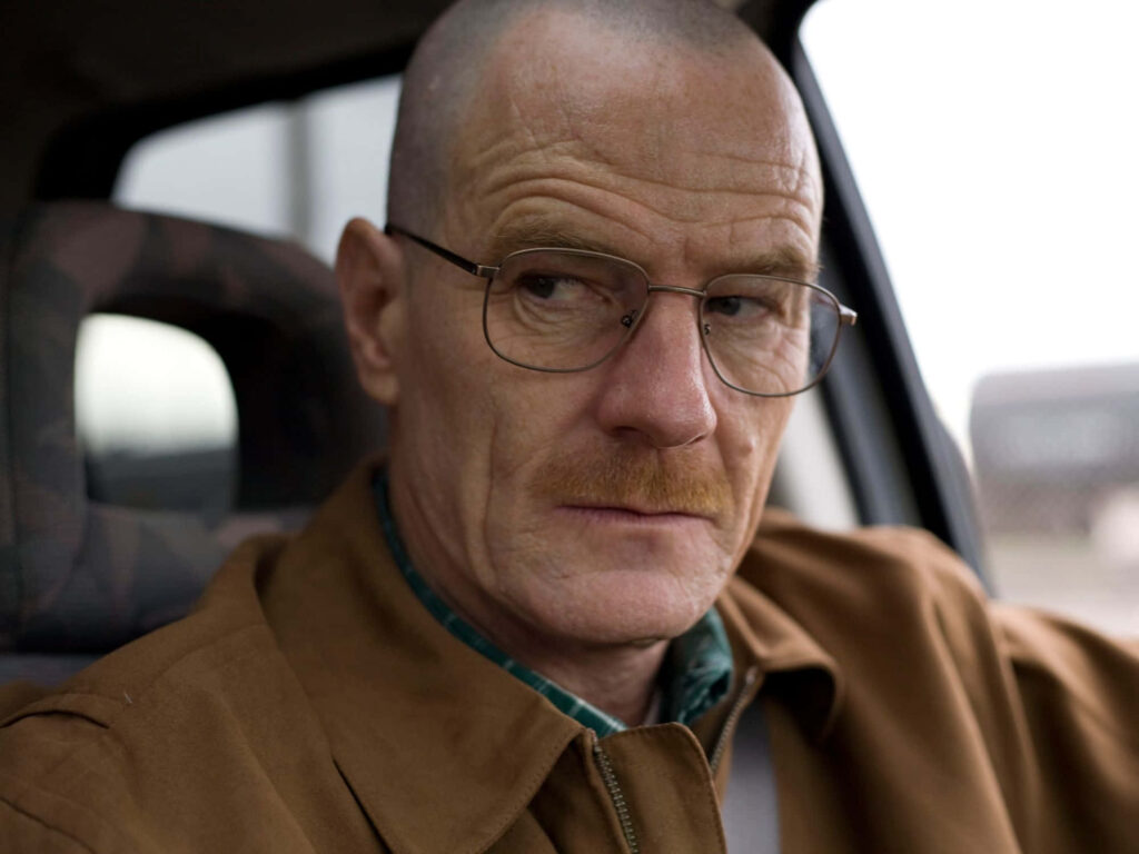 Bryan Cranston close-up portrait in car wearing glasses and brown jacket high definition wallpaper
