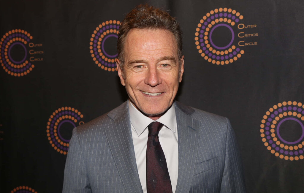 Bryan Cranston in grey pinstripe suit with colorful circles dark background celebrity wallpaper