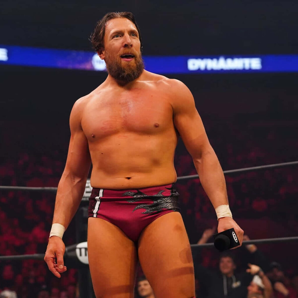 Bryan Danielson AEW Dynamite wrestler in maroon trunks holding microphone in wrestling ring wallpaper