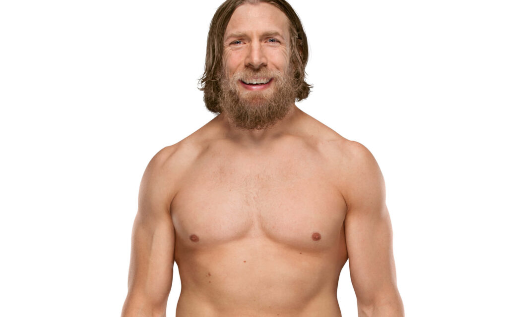 Bryan Danielson wrestling move wallpaper athletic physique determined expression white background