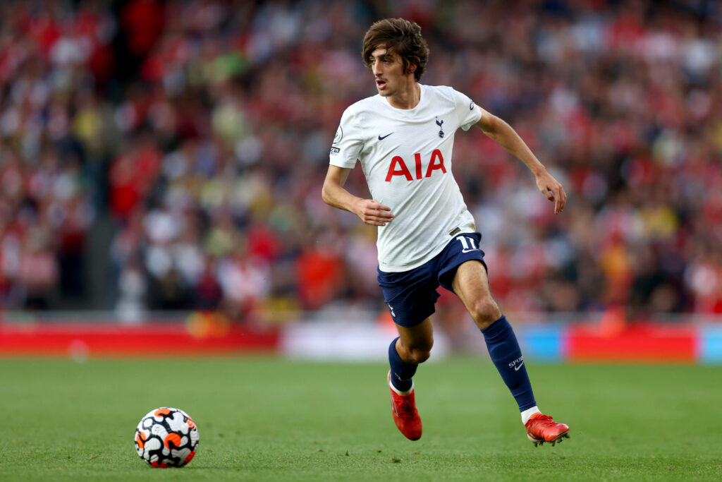 Bryan Gil in action for Tottenham Hotspur wearing red shoes dynamic football wallpaper background