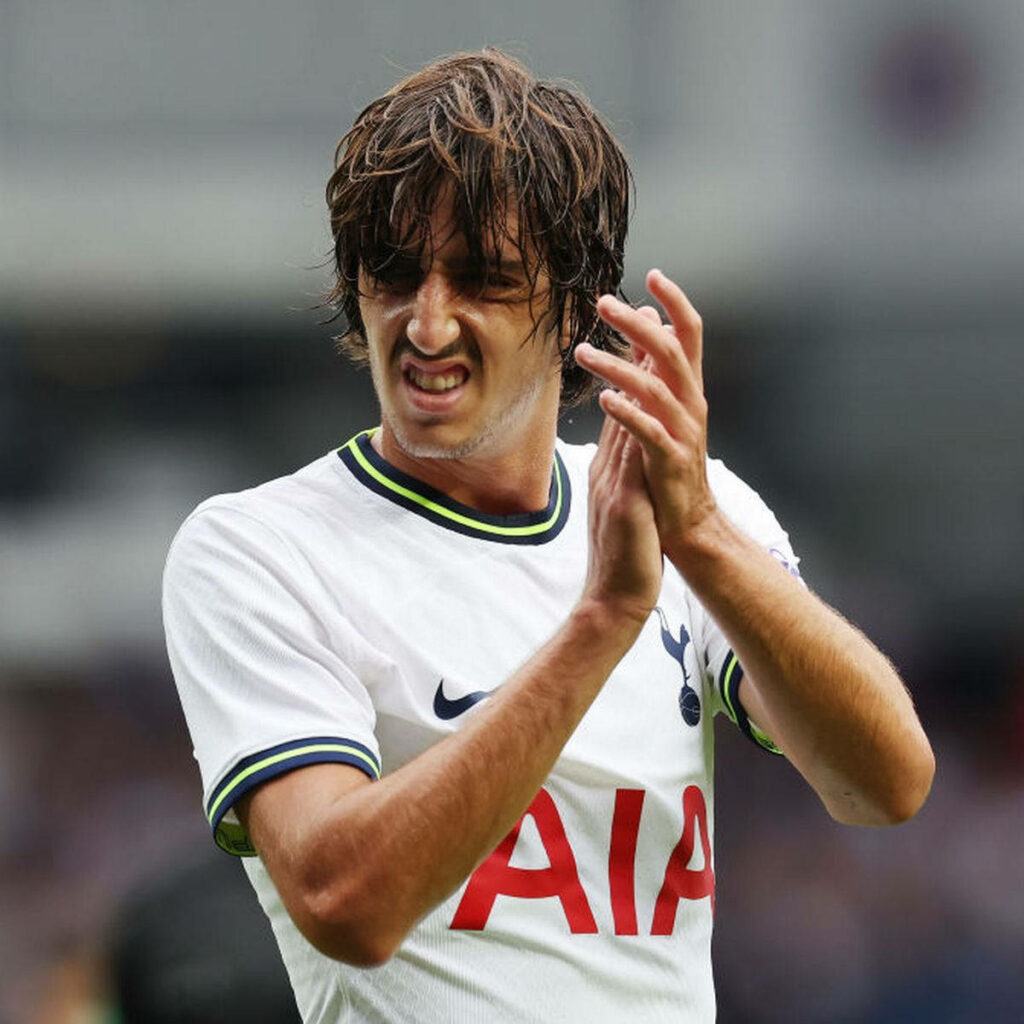 Bryan Gil clapping in Tottenham Hotspur jersey mid-action stadium background dynamic football wallpaper
