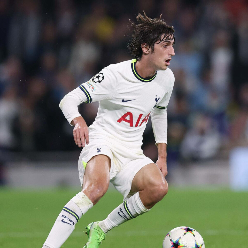 Bryan Gil Tottenham Hotspur in all white kit dynamic action stadium background football wallpaper