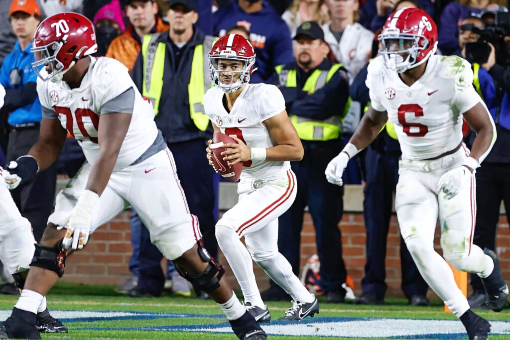 Bryce Young Alabama Crimson Tide quarterback in action during intense football game wallpaper background