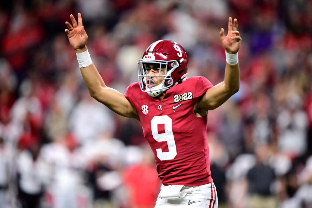 Bryce Young Alabama quarterback signaling play in crimson jersey dynamic stadium football wallpaper