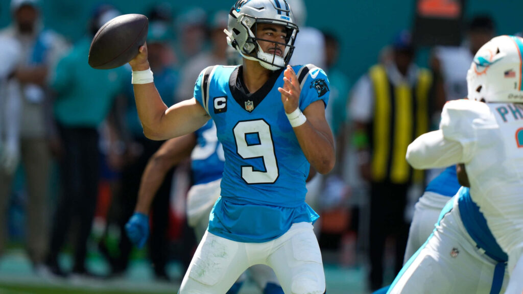 Bryce Young Panthers quarterback throwing football in vibrant blue silver uniform HD game action wallpaper