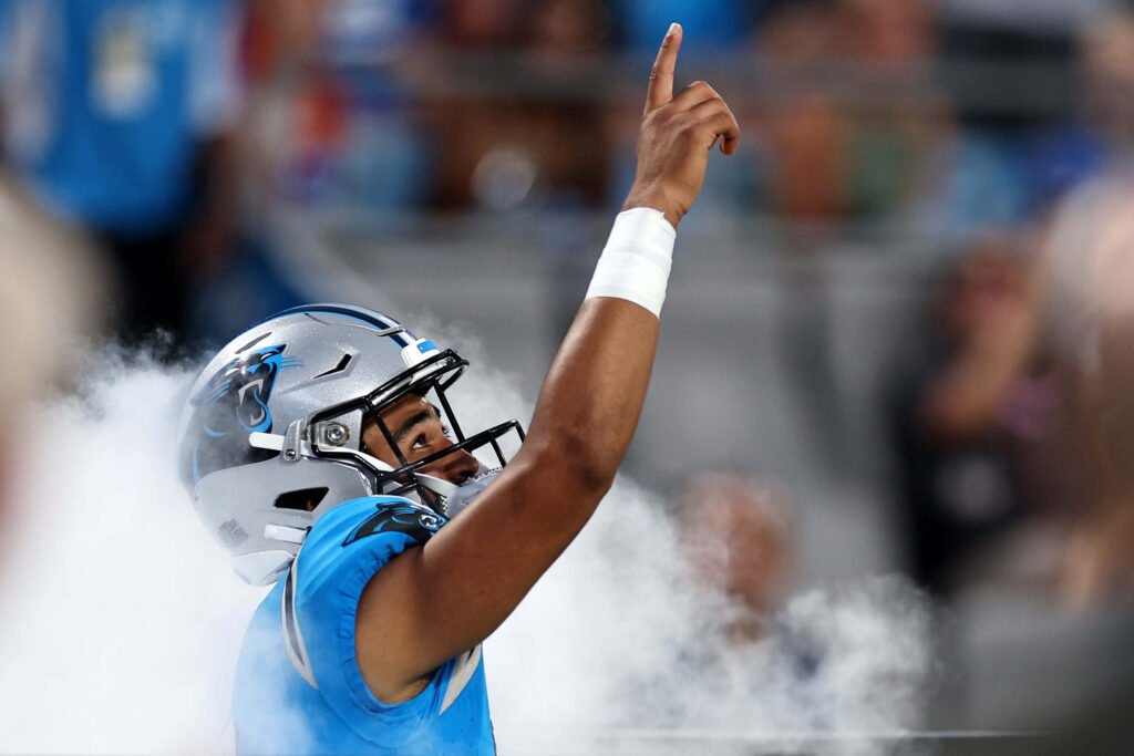 Bryce Young Panthers quarterback pointing up in stadium with dramatic lighting and smoke background Wallpaper