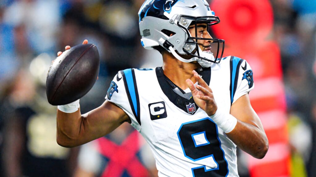 Bryce Young Panthers quarterback in action wearing NFL gear on vibrant stadium football wallpaper