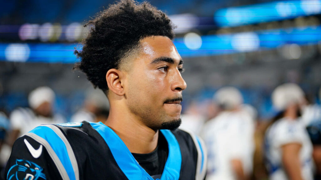 Bryce Young Carolina Panthers quarterback close-up in blue black uniform NFL stadium wallpaper