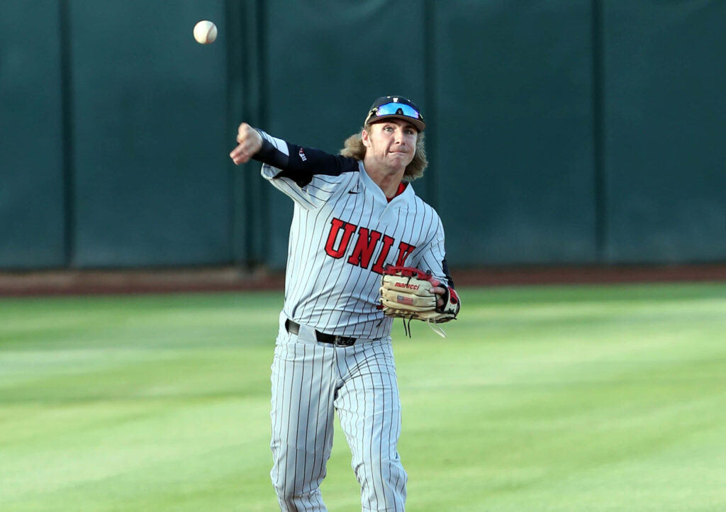 Bryson Stott baseball action throw gray pinstripe uniform game green field high resolution wallpaper