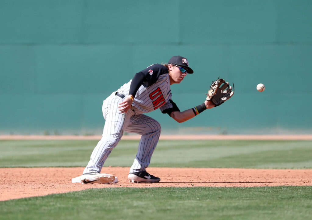 Bryson Stott sharp infield baseball fielding play in striped uniform vivid green background wallpaper