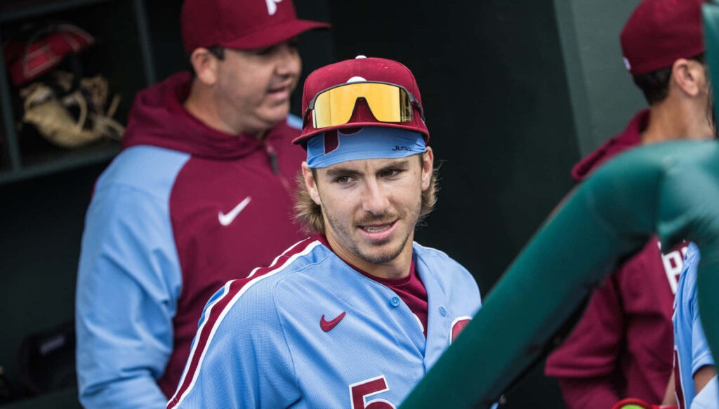 Bryson Stott in Philadelphia Phillies retro powder blue uniform in team dugout wallpaper background