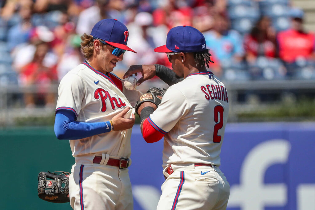 Bryson Stott Phillies celebrating on field vibrant team spirit high resolution baseball action wallpaper