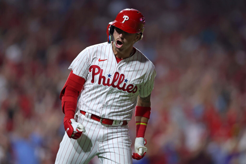 Bryson Stott Phillies intense MLB game moment wallpaper vibrant stadium action background