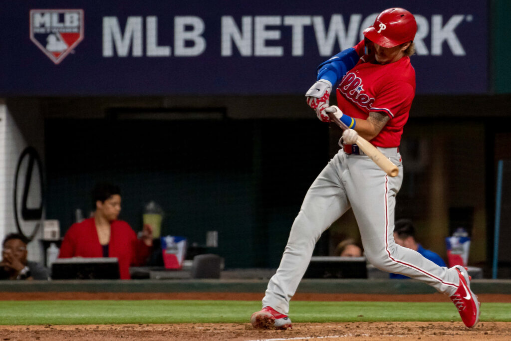 Bryson Stott Phillies red uniform powerful bat swing baseball action stadium wallpaper background