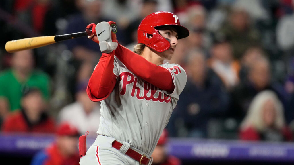 Bryson Stott Phillies batting power swing in full uniform vibrant red and white baseball wallpaper