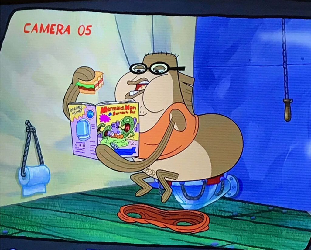 Bubble Bass in SpongeBob cartoon sitting on toilet eating sandwich reading vibrant Mermaid Man comic Wallpaper